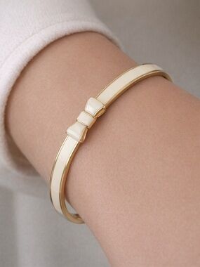 Kate Spade “Take a Bow” Cream Enamel Bow Bangle Bracelet NWT